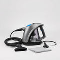 High-pressure handheld steam cleaner with hose and brush attachments